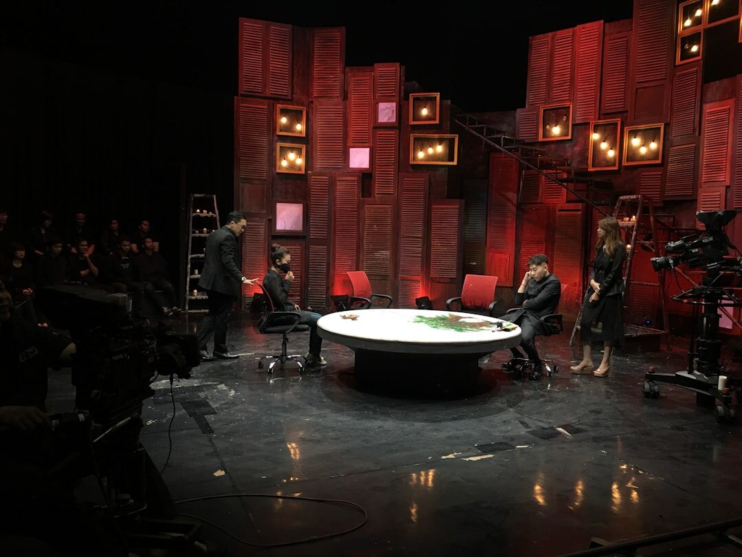 Professional broadcast studio design with stage lighting and set layout