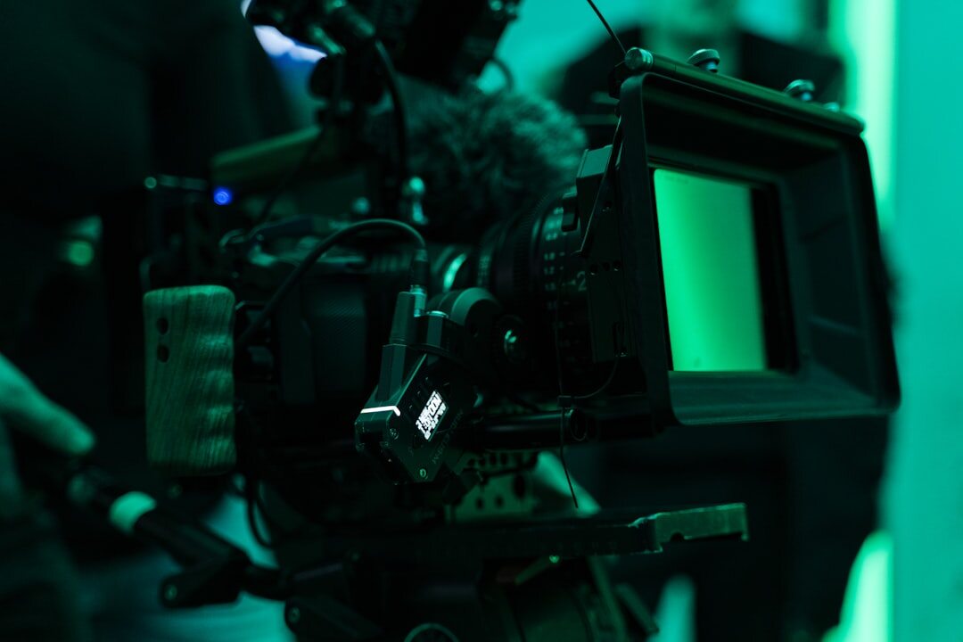 Professional broadcast camera on a heavy duty tripod in a studio